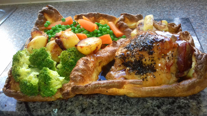 Turkey Thigh dinner in a giant Gluten free Yorkshire Pudding